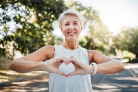 fitness-happy-and-heart-hands-of-old-woman-in-nature-after-running-for-health-wellness-and.jpg
